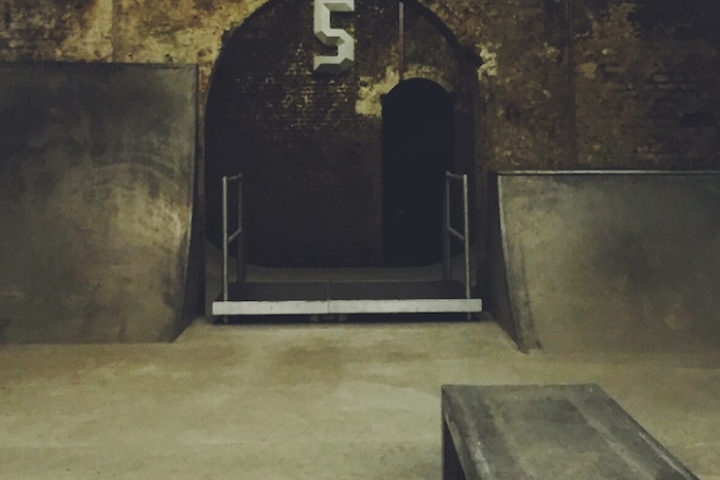 An indoor skate park that looks like old tunnels