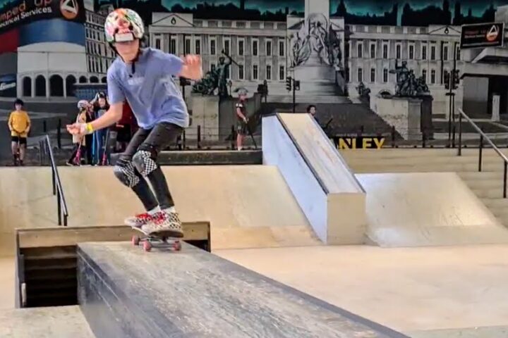 Skateboarder on street section at Rush skatepark